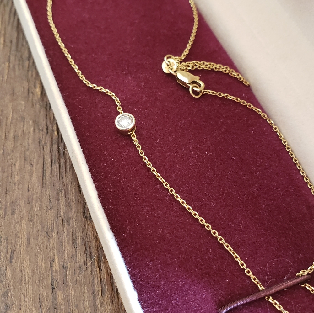 14k gold Bezel set diamond necklace pendant in Zales Diamond Store gift box.